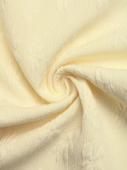 Chic Tie Strap Wide-leg Jumpsuit in pale yellow textured fabric with subtle floral pattern.
