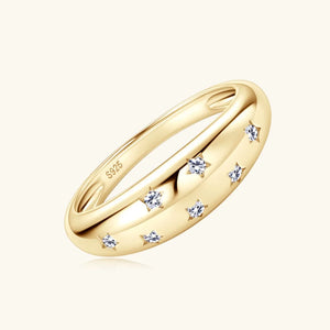 Gold dome ring with starbursts and cubic zirconia accents