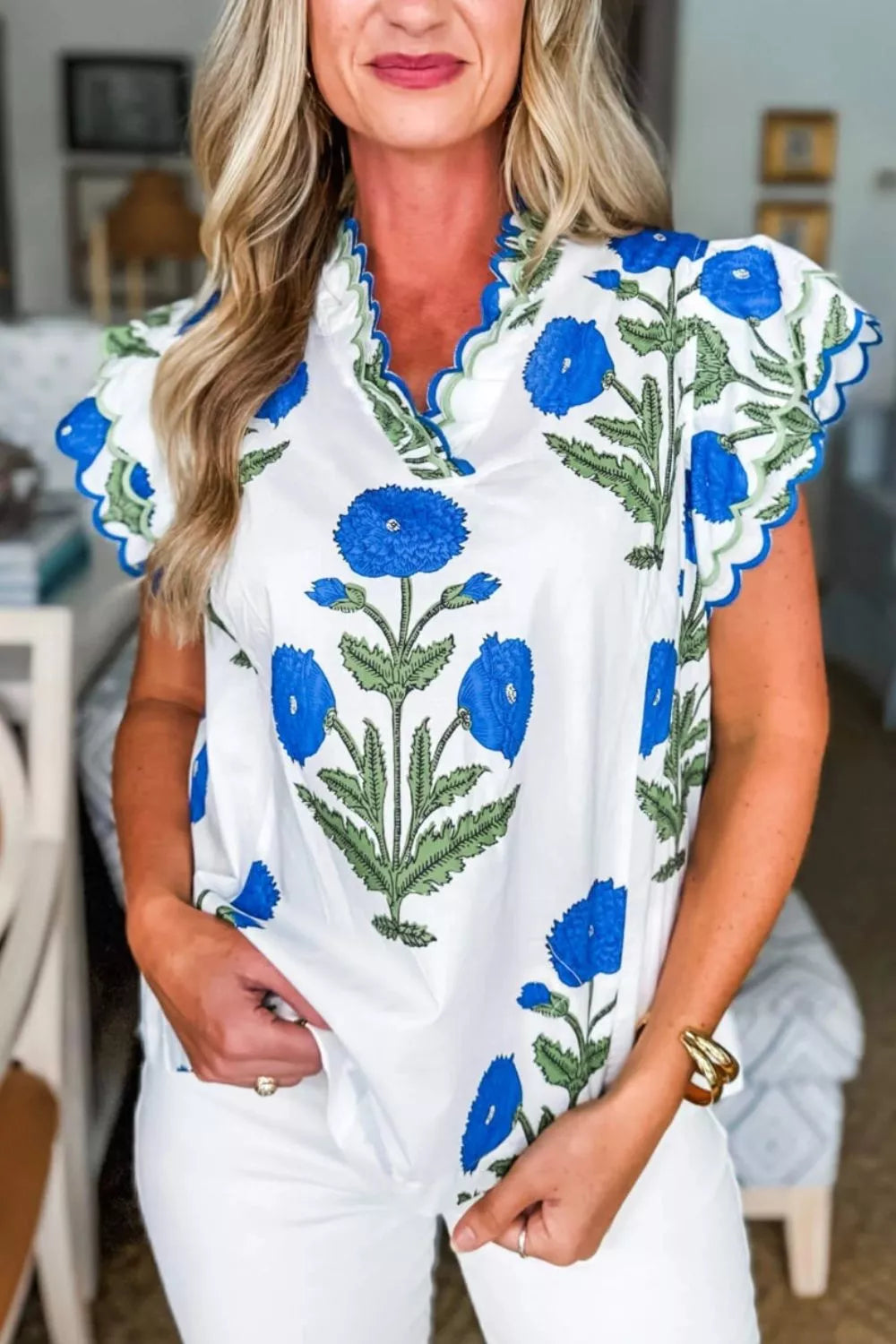 White cotton blouse with blue floral print and scalloped trim