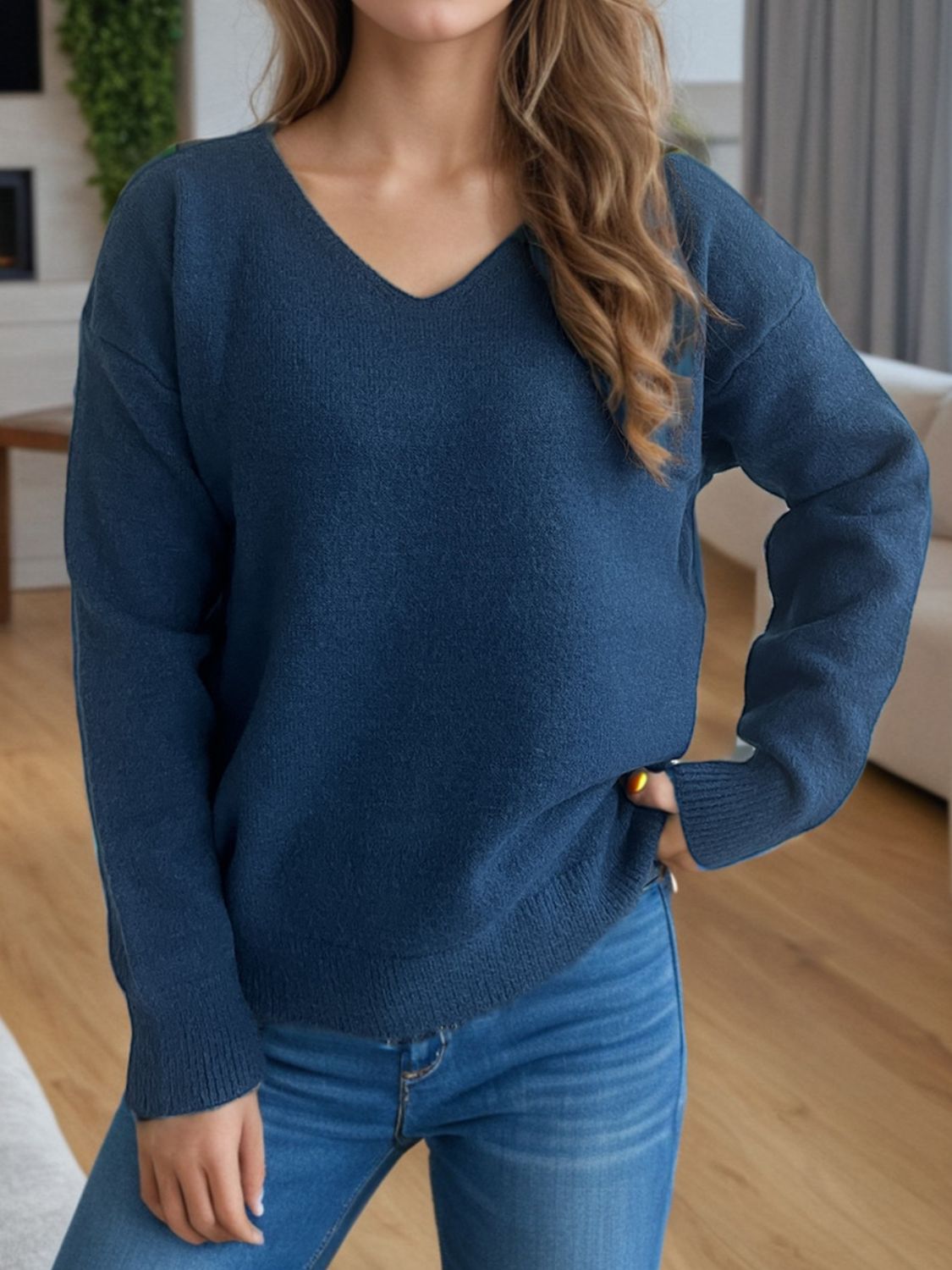 Relaxed-fit acrylic V-neck sweater in Peacock Blue with ribbed hem and cuffs.
