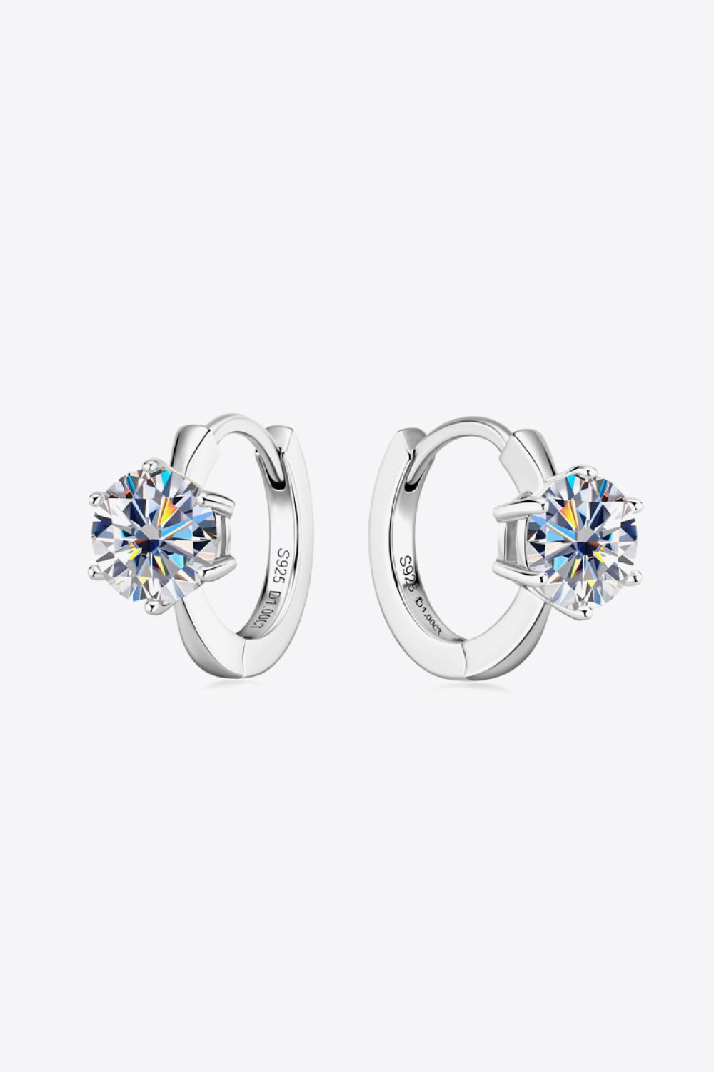 Silver moissanite solitaire huggie hoop earrings with sparkling round-cut stones.