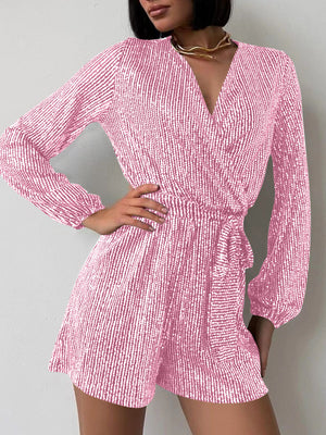 Pink sequin wrap romper with blouson sleeves and tie waist