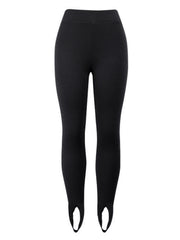 Black ribbed knit stirrup leggings with a high waist.
