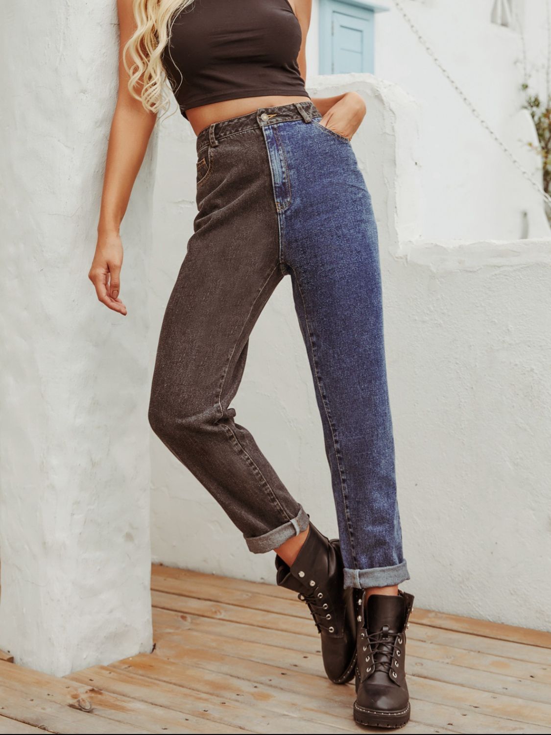 Split-tone straight leg jeans in medium wash denim with a contrasting dark wash panel.
