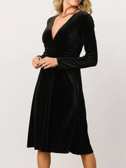 Black velvet midi dress with a-line skirt and deep V-neck.