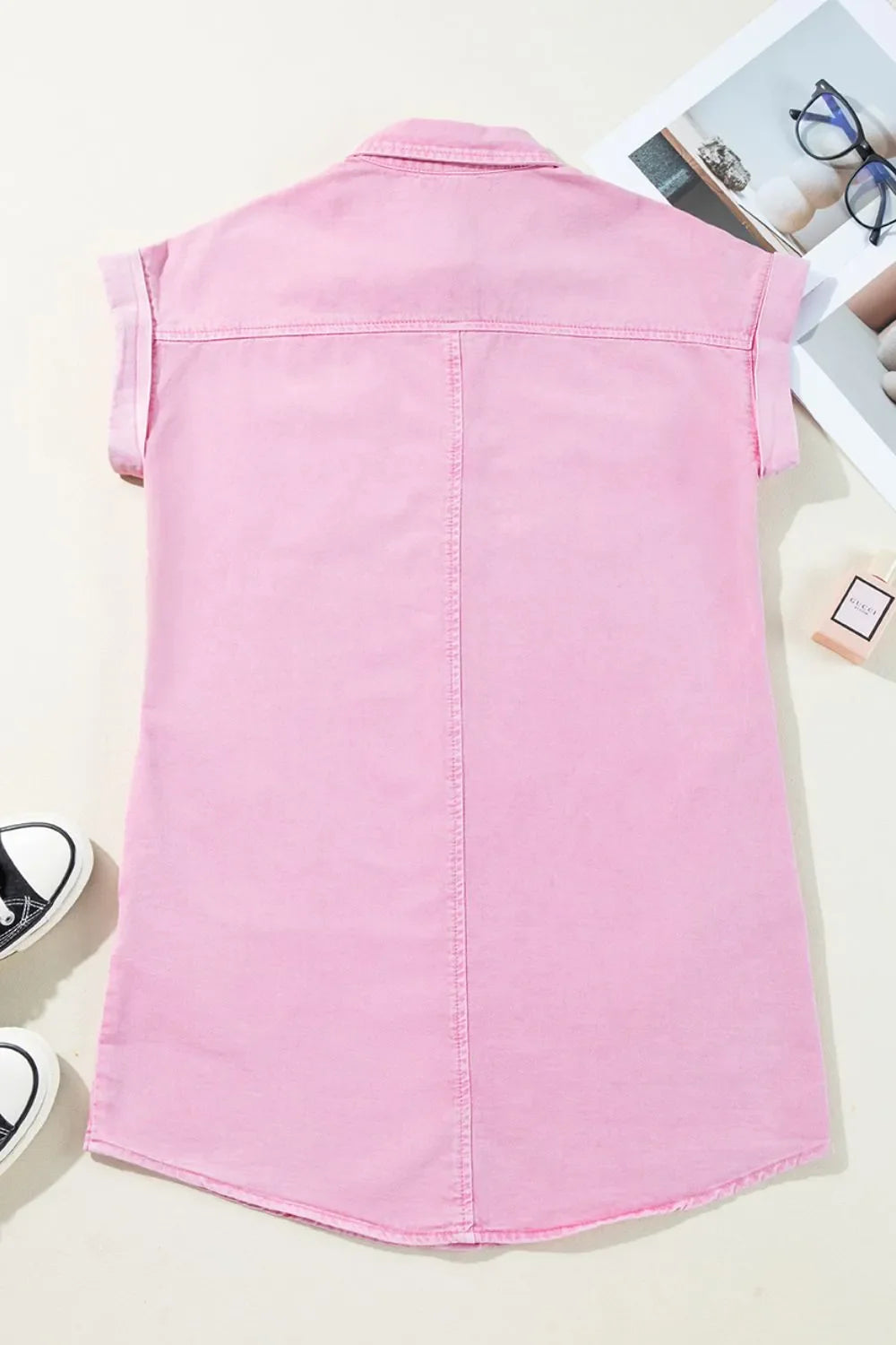 Rolled sleeve denim shirtdress in blush pink with button details.
