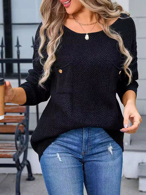 Black textured knit sweater with a single chest pocket and gold button detail.
