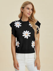 Black knit top with white daisy print and ruffle cap sleeves