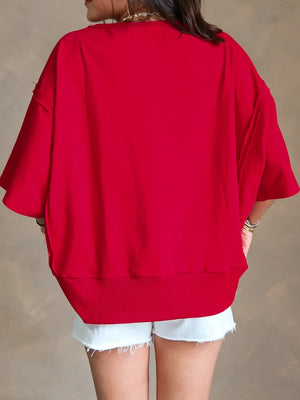 Red cotton blend drop shoulder tee with wide sleeves and ribbed hem.