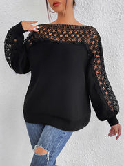 Black acrylic sweater with boatneck, balloon sleeves, and lace inset details.