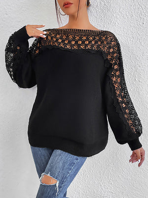 Black acrylic sweater with boatneck, balloon sleeves, and lace inset details.