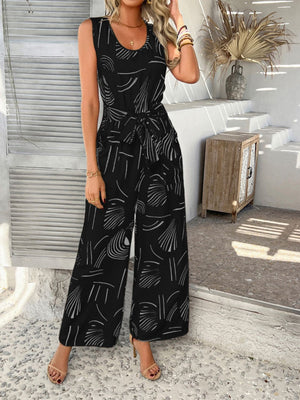 Black abstract print wide-leg jumpsuit with tie waist and scoop neck.