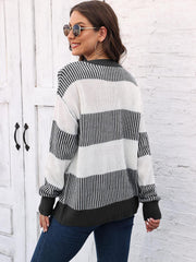 Striped knit crewneck sweater with ribbed trim in black and white acrylic.