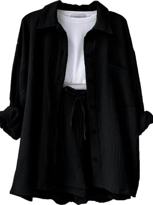 Black textured gauze shirt and shorts set with drawstring waist and white ribbed tank top.