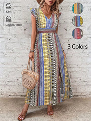 Bohemian maxi dress with ruffle sleeves, V-neck, and side slit in a colorful print.