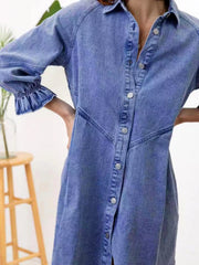 Dusty blue denim button-down dress with ruffled cuffs and silver buttons.