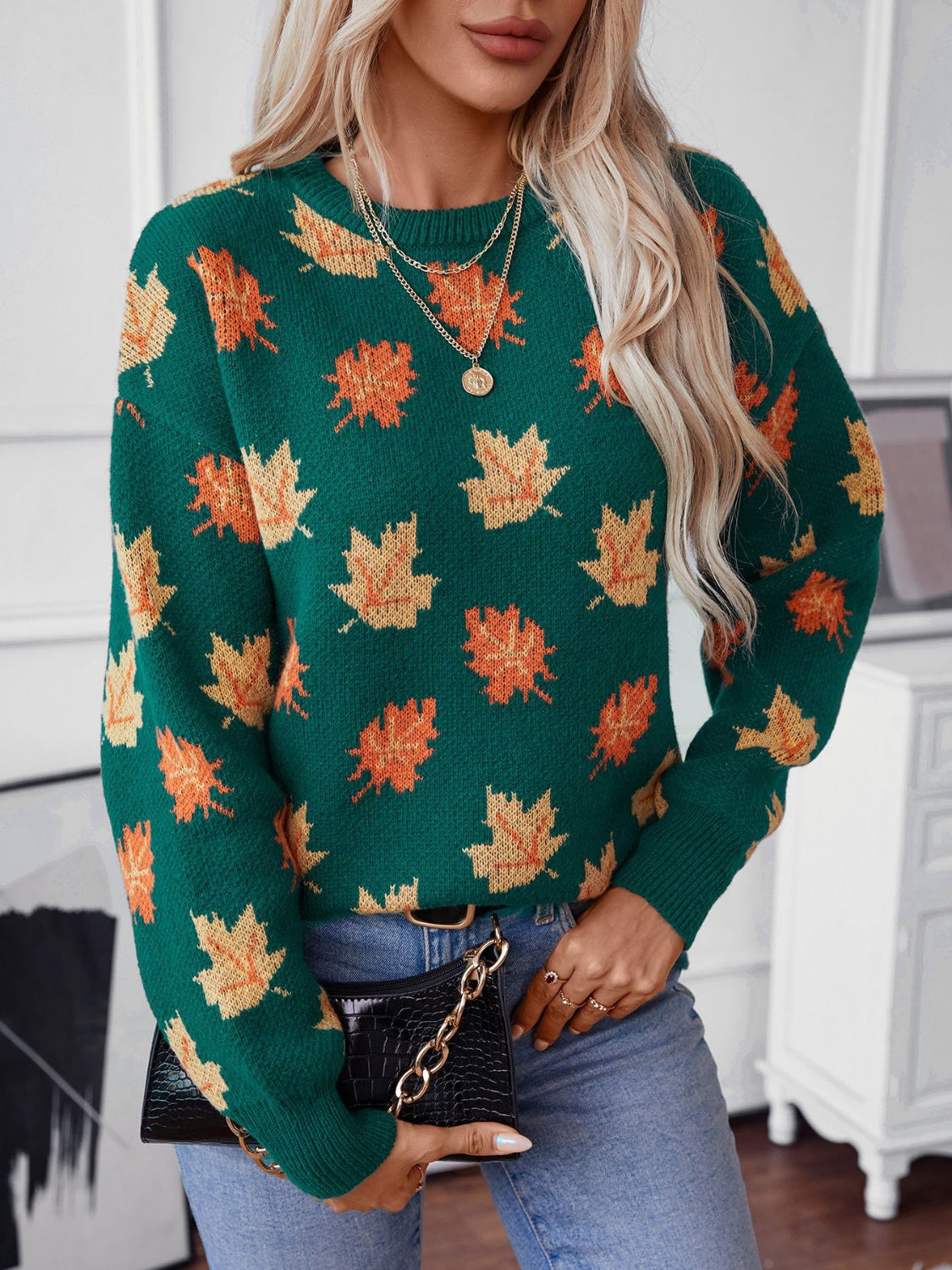 Green knit jumper with autumnal leaf motif, crew neck, long sleeves.