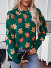Green knit jumper with autumnal leaf motif, crew neck, long sleeves.