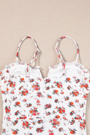 White floral bustier camisole with ruffle trim and adjustable straps.