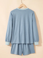 Light blue checkerboard loungewear set with long sleeve pullover and shorts.