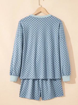 Light blue checkerboard loungewear set with long sleeve pullover and shorts.