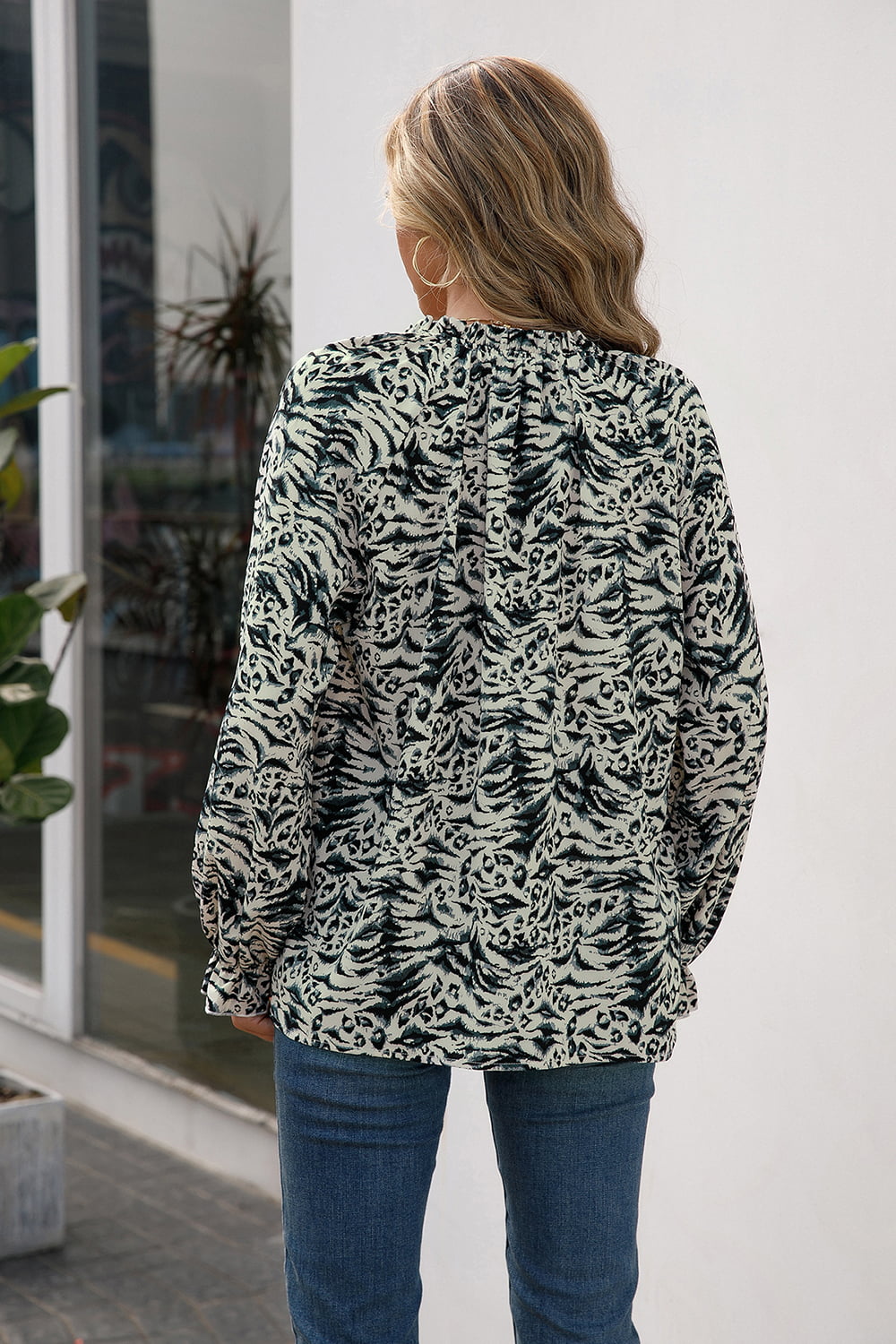 Animal print ruffle neck blouse with long sleeves