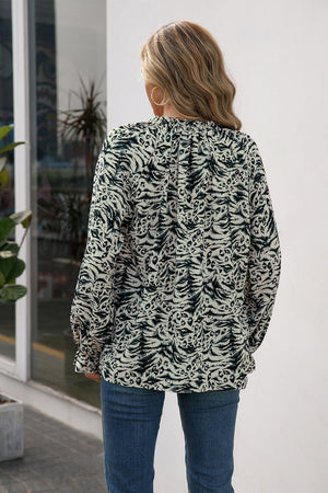 Animal print ruffle neck blouse with long sleeves