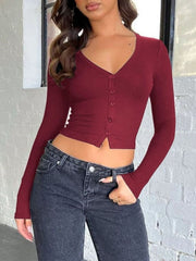 Burgundy ribbed V-neck crop top with button front and long sleeves
