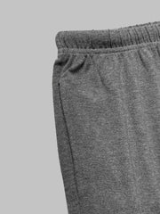 Grey drawstring pants with elastic waistband and side pocket detail.