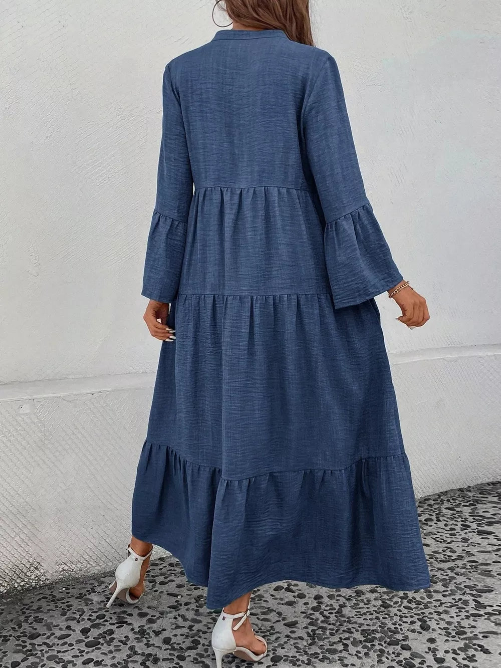 Blue tiered ruffle hem maxi dress with bell sleeves and button front.