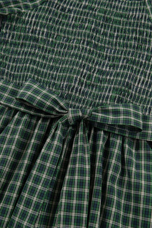 Green plaid maxi dress with smocked bodice and bow detail