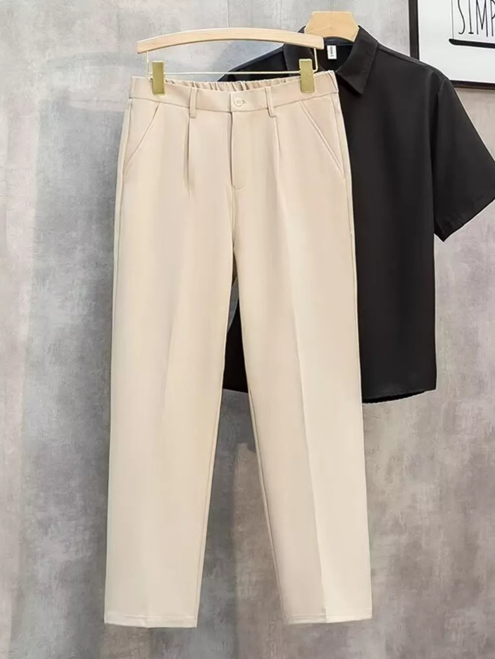 Khaki straight-leg cargo pants with elastic waistband and button closure.
