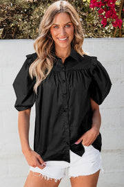 Black poplin blouse with gathered detail and puff sleeves, button front, collared neckline.