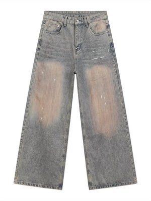 Relaxed fit blue 100% cotton jeans with distressed vintage wash and baggy legs.