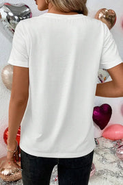 White graphic t-shirt with short sleeves and a crew neck, styled casually.