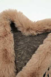Beige faux fur trim cape with leopard print detail and textured knit fabric.