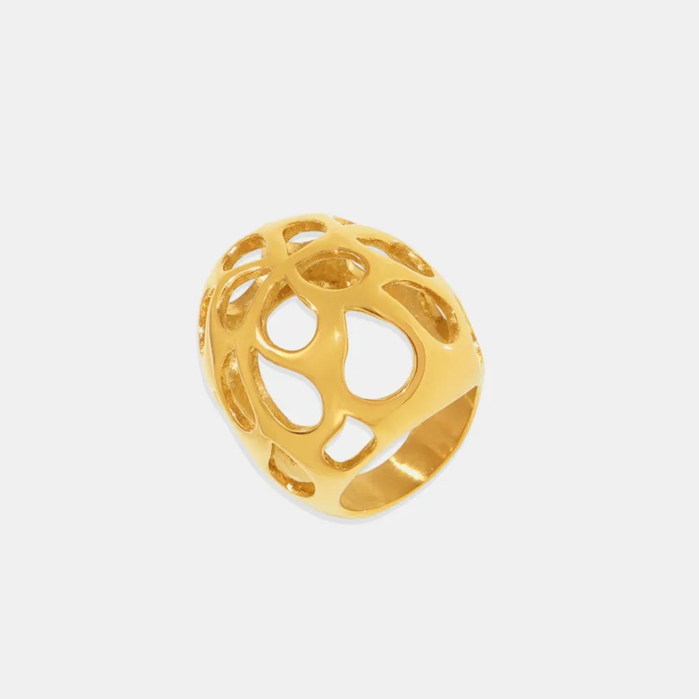 Gold openwork orb ring with contemporary cutouts.