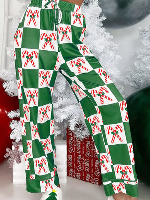 Green checkered pajama pants with candy cane print and drawstring waist