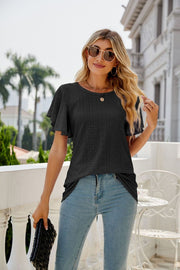 Black eyelet flounce sleeve crew neck top with casual styling.