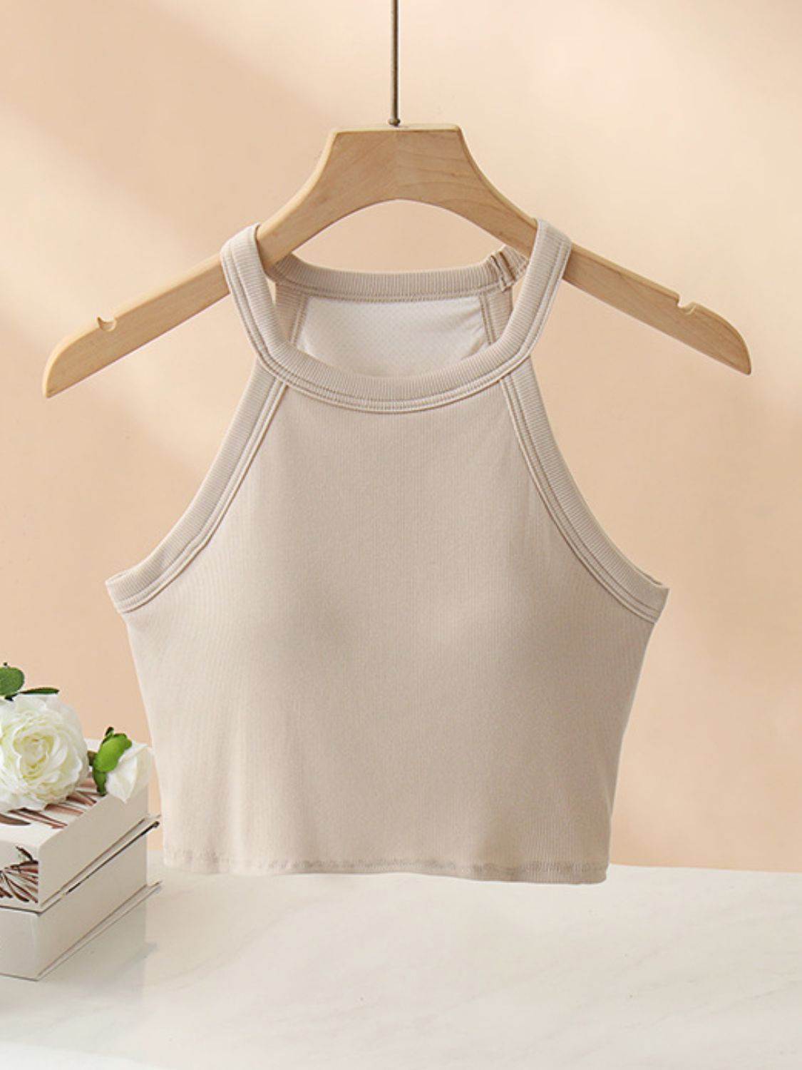 Camel ribbed halter crop top with contrast stitching detail.