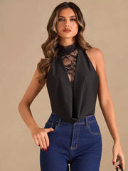 Black lace-trimmed sheer halter bodysuit with a cowl neck, worn with jeans.