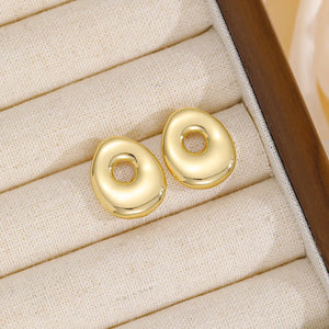 Alphabetical sculpted stud earrings in gold tone copper, abstract bubble shape.