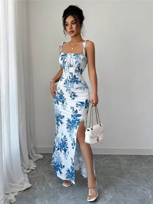 Floral print maxi dress in Peacock Blue with tie straps, ruched sides, and a high slit.
