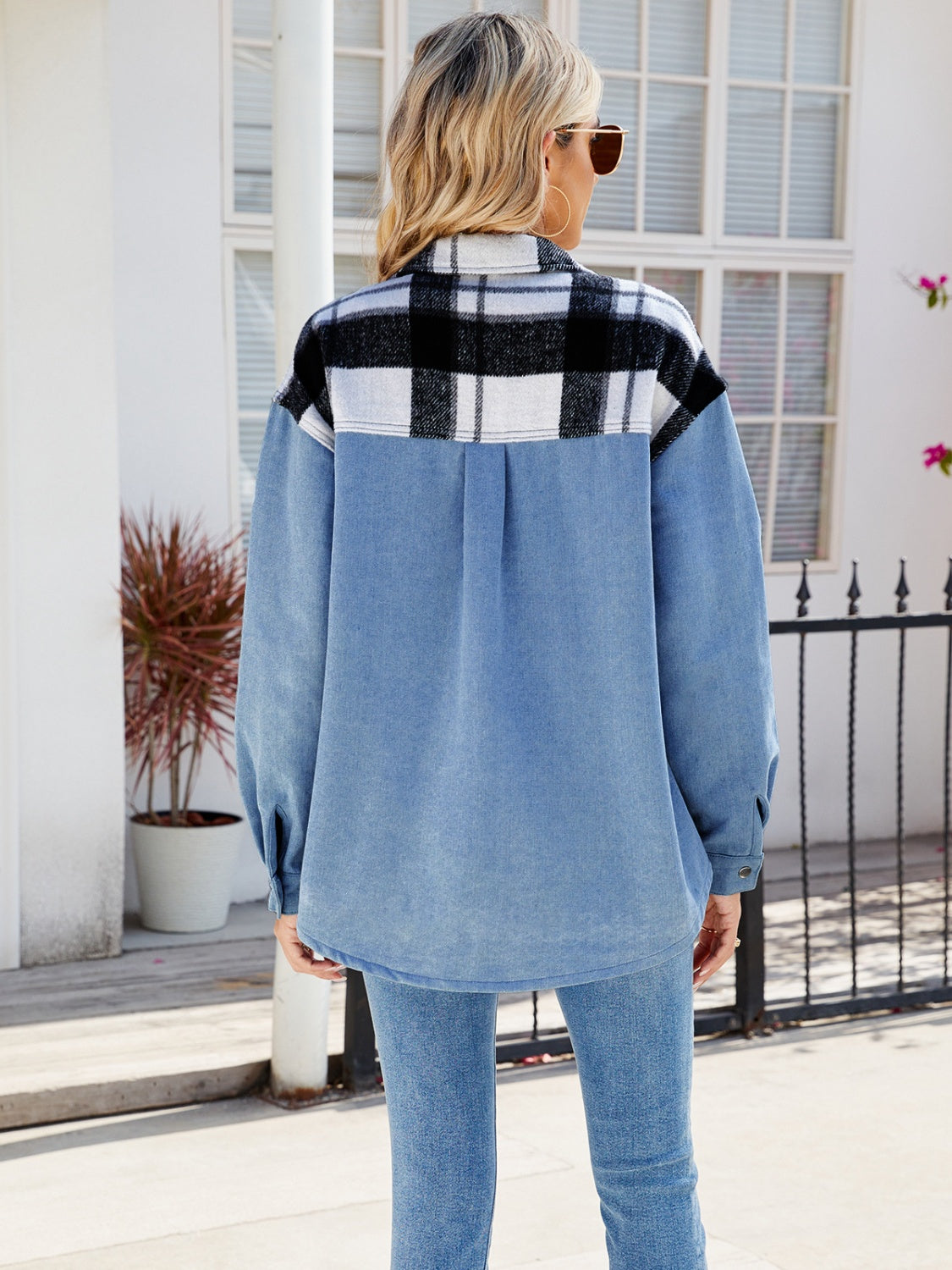 Colorblock plaid denim shacket in dusty blue with black and white plaid yoke and back detail.