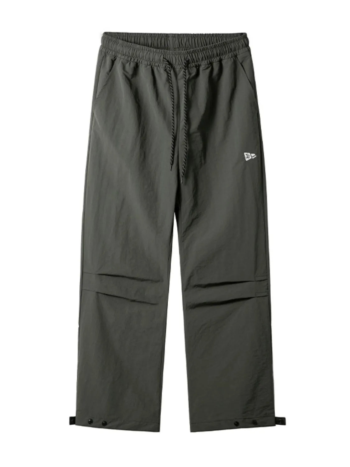 Dark gray utility joggers with drawstring waist, cargo pockets, and adjustable ankle cuffs.