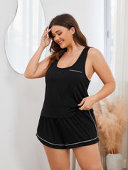 Black loungewear set with contrast trim, racerback tank top with pocket, and matching shorts.