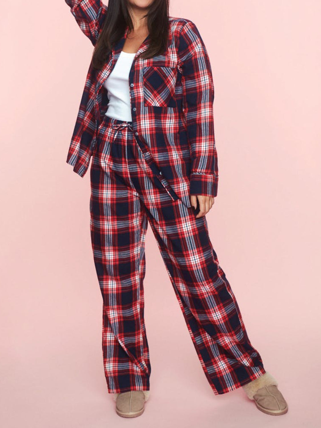 Crimson plaid pajama set with button-up shirt and drawstring pants in 100% polyester.