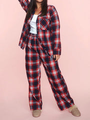 Crimson plaid pajama set with button-up shirt and drawstring pants in 100% polyester.