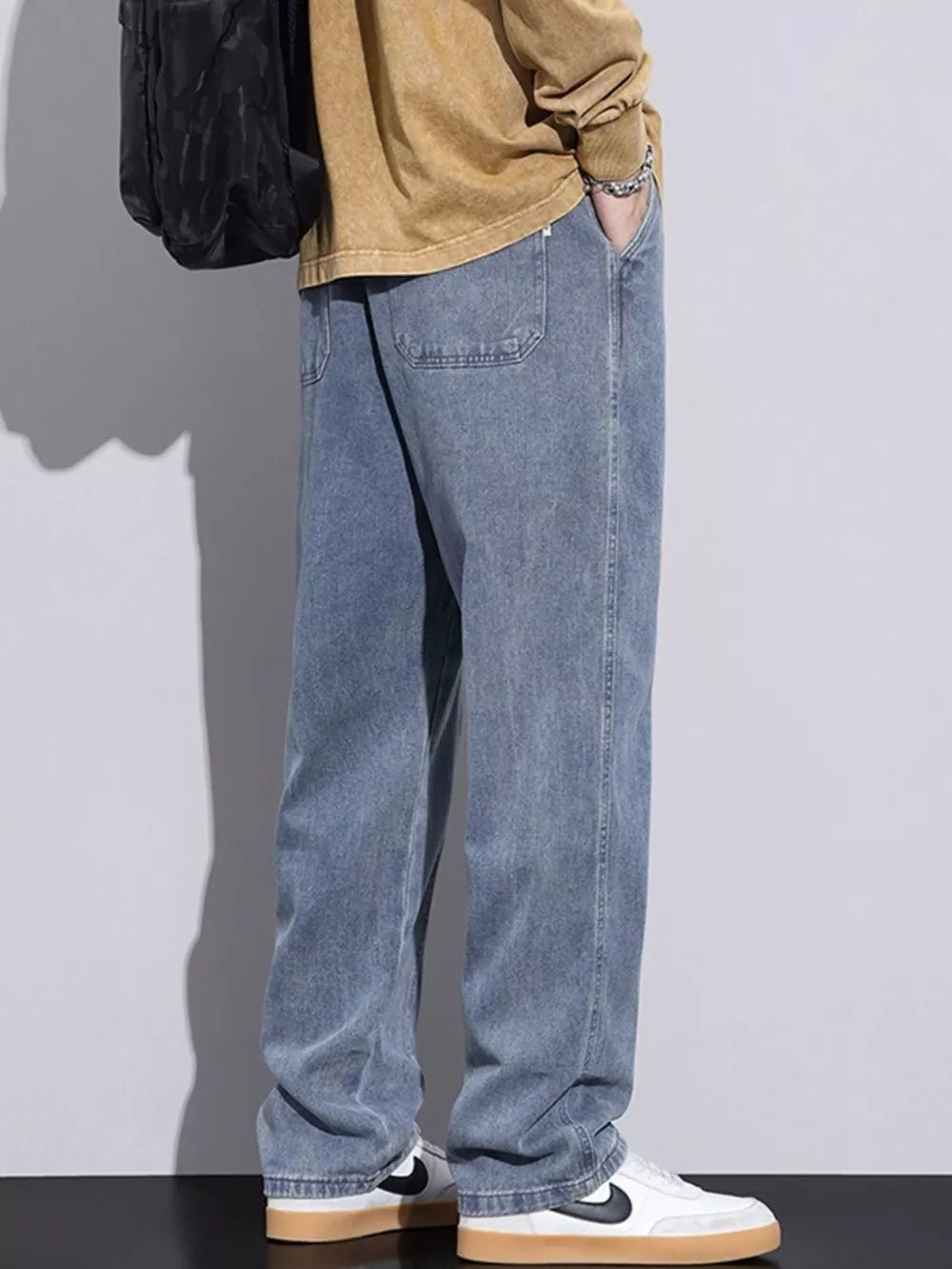 Relaxed fit denim jeans in Air Force Blue with drawstring waist and casual styling.
