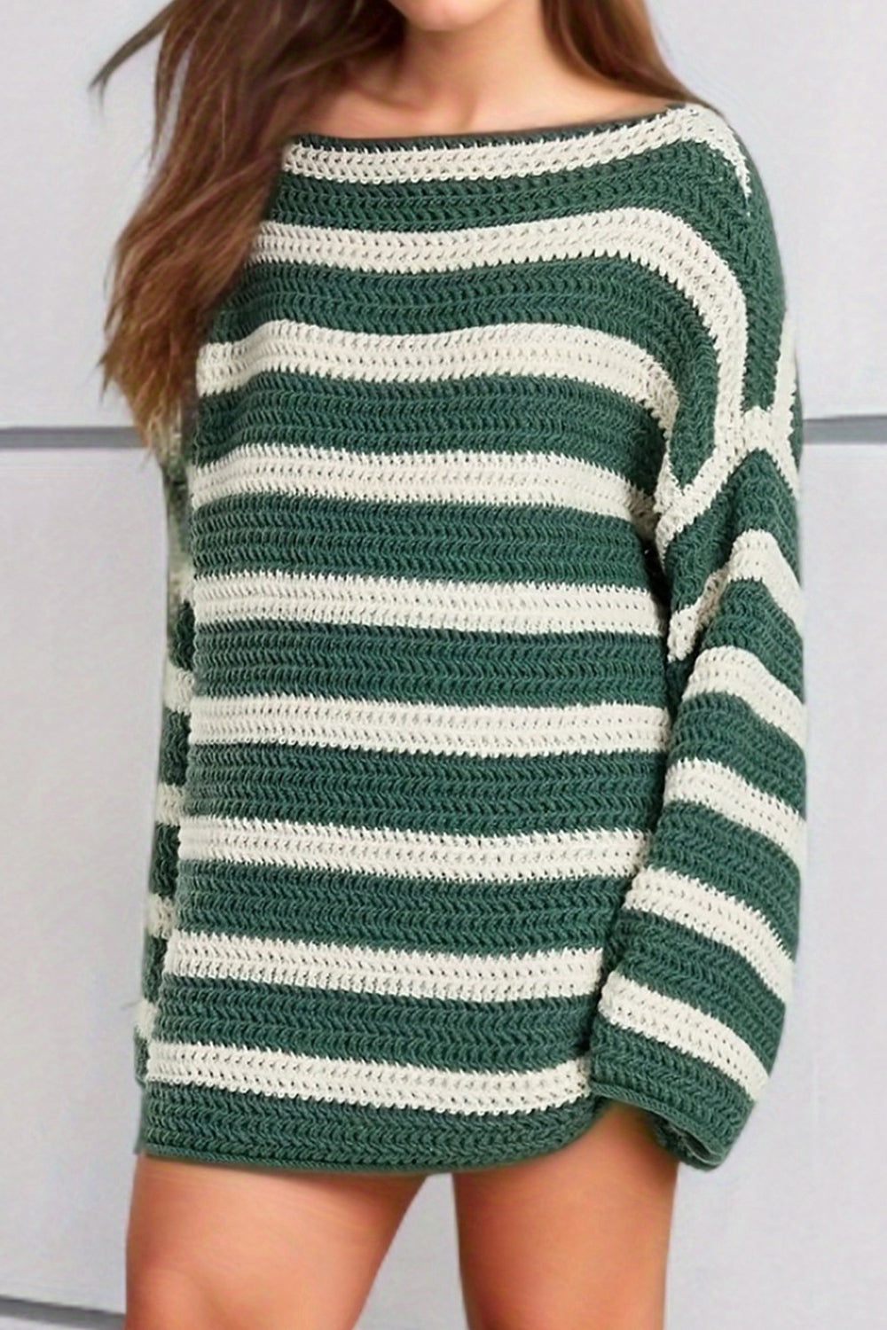 Green and cream striped boat neck knit sweater with crochet texture.
